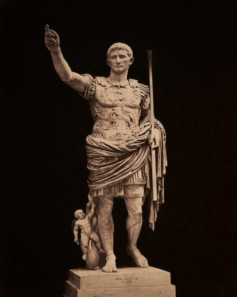 Statue of roman emperor augustus points upward.